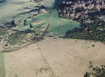 Oblique aerial view centred on the remains of the recumbent stone circle, taken from the SW.