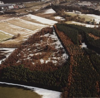Oblique aerial view of the remains of fort and rig, taken from the NW.