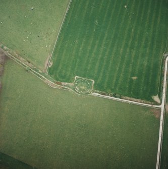 Oblique aerial view of the remains of the recumbent stone circle, taken from the SE.