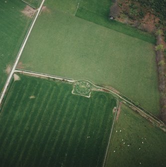 Oblique aerial view of the remains of the recumbent stone circle, taken from the NNW.