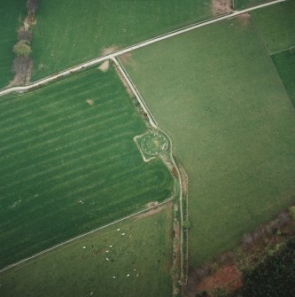 Oblique aerial view of the remains of the recumbent stone circle, taken from the W.