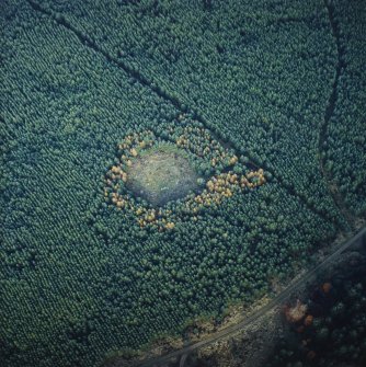 Oblique aerial view centred on the remains of the recumbent stone circle, taken from the SW.