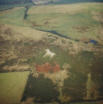 Oblique aerial view centred on the White Horse hill figure, taken from the S.