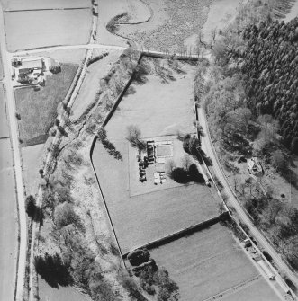 Oblique aerial view centred on the remains of the abbey and the house, farmhouse and farmsteading, taken from the ESE.