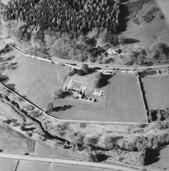 Oblique aerial view centred on the remains of the abbey and the house, taken from the S.