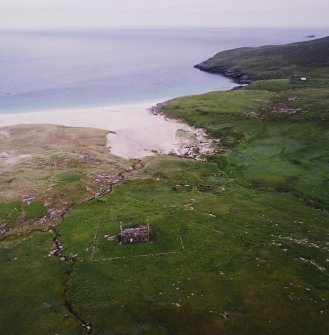 General oblique aerial view centred on the remains of the chapel house and enclosure with the remains of the township, chapel and graveyard and the school and schoolroom adjacent, taken from the NW.