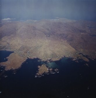 General oblique aerial view centred on the crofting townships of Skallary and Earsary, looking across Sheabhal towards Borgh, taken from the SE.