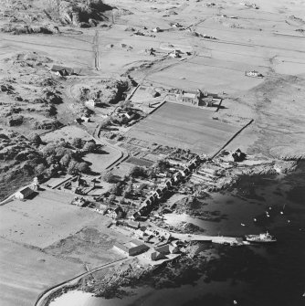 Oblique aerial view of Iona, taken from the south east, centred on the town.