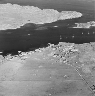 Oblique aerial view of Arinagour, taken from the north west, centred on the town.