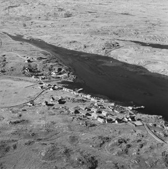 Oblique aerial view of Arinagour, taken from the south west, centred on the town.