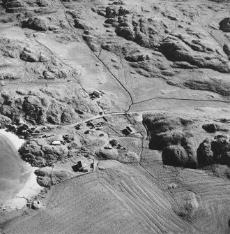 Oblique aerial view of Sorisdale, taken from the north, centred on the cottages.