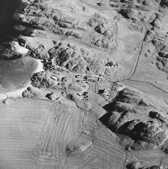 Oblique aerial view of Sorisdale, taken from the north, centred on the cottages.