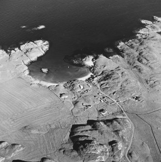 Oblique aerial view of Sorisdale, taken from the north west, centred on the cottages.