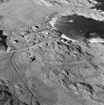 Oblique aerial view of Sorisdale, taken from the south, centred on the cottages.