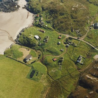 Oblique aerial view of Sorisdale centred on cottages, taken from the N.