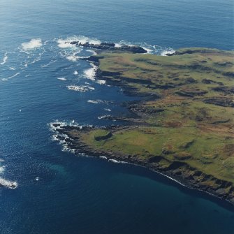 Oblique aerial view centred on the remains of the fort, taken from the NE.