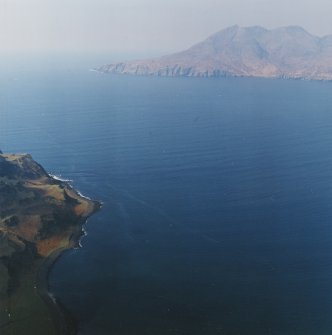 General oblique aerial view of the remains of the fort with Rum in the distance, taken from the ESE.