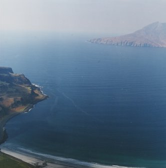 General oblique aerial view of the remains of the fort with Rum in the distance, taken from the ESE.