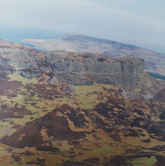 Oblique aerial view centred on the remains of the An Sgurr fort, taken from the SSW.