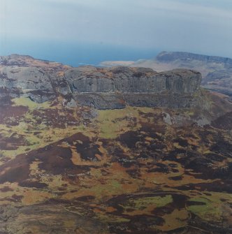 Oblique aerial view centred on the remains of the An Sgurr fort, taken from the SSW.