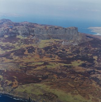 Oblique aerial view centred on the remains of the An Sgurr fort, taken from the S.