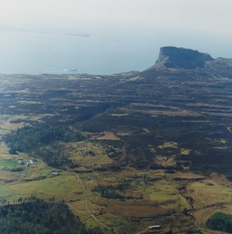 General oblique aerial view looking across Sandavore farmsteading towards An Sgurr fort, taken from the ENE.