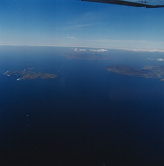 General oblique aerial view of Eigg, Muck and Rum, taken from the SE.