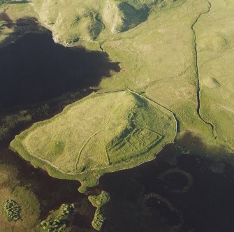 Oblique aerial view of Eilean A Bharain, taken from the south west, centred on a farmstead.