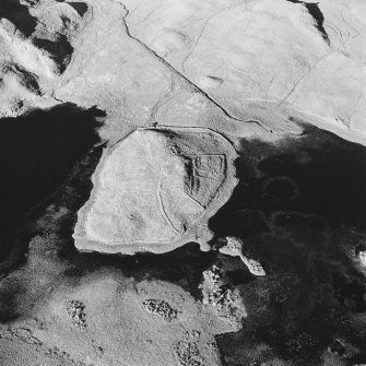Oblique aerial view of Eilean A Bharain, taken from the west, centred on farmstead.