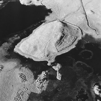 Oblique aerial view of Eilean A Bharain, taken from the south 03061997west, centred on farmstead.