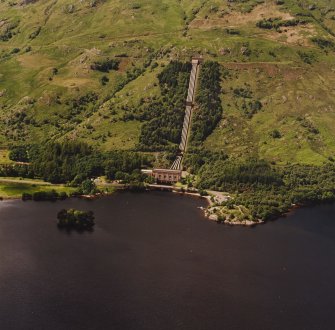 Oblique aerial view of Inveruglas centred on Loch Sloy Hydro-Electric Power Station, taken from the ESE.