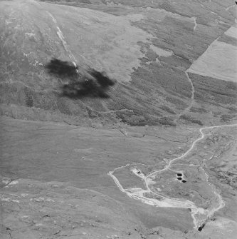 Oblique aerial view centred on the mine and buildings, taken from the WSW.