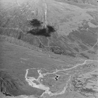 Oblique aerial view centred on the mine and buildings, taken from the SW.