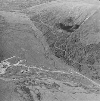 Oblique aerial view centred on the mine and buildings, taken from the SSE.