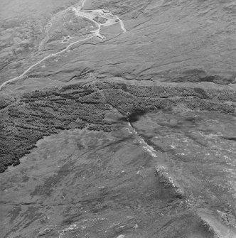 Oblique aerial view centred on the mine and buildings, taken from the NE.