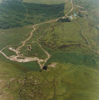 Oblique aerial view centred on the mine and buildings with farmstead adjacent, taken from the WSW.