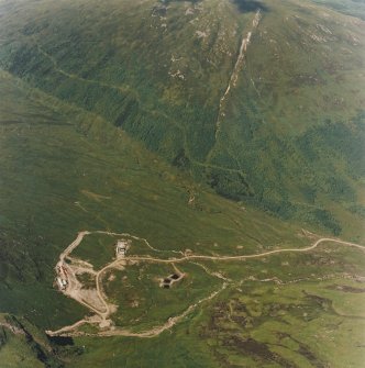 Oblique aerial view centred on the mine and buildings, taken from the SSW.