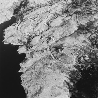 Oblique aerial view of Duart centred on the remains of the township, rig, field-system and head-dyke, taken from the SW.
