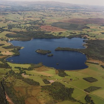 General oblique aerial view of the Lake of Menteith centred on the priory and crannog, taken from the W.