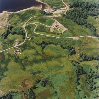 Oblique aerial view centred on the remains of the field-system, rig and head-dyke, taken from the SE.