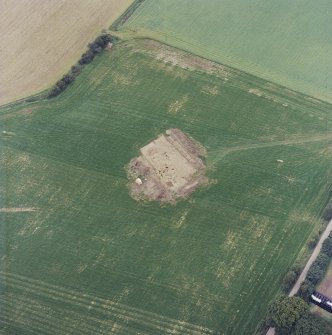 Oblique aerial view centred on the excavation of the timber hall, taken from the NE.