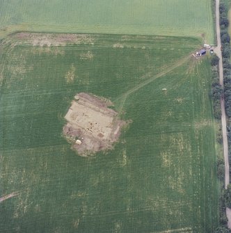 Oblique aerial view centred on the excavation of the timber hall, taken from the ENE.
