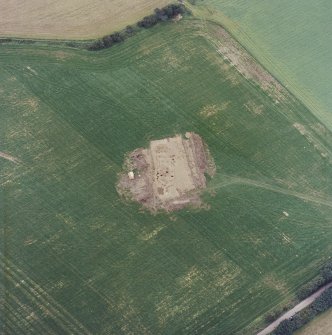 Oblique aerial view centred on the excavation of the timber hall, taken from the NNE.