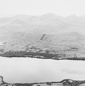 General oblique aerial view looking across Loch Tay and the farmsteads of Craggantoul, Cragnester and Balnasuim towards Ben Lawers, taken from the SE.