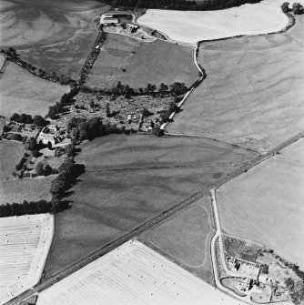 Tullichettle, oblique aerial view, taken from the SE, centred on the cropmarks of an old road, and a pit-defined cursus monument. Dalginross Roman Temporary Camp is visible in the top half of the photograph.