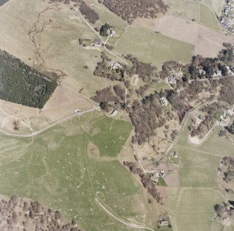 Aerial view of buildings, huts and enclosures to the NW of Newtonmore, taken from the SW.