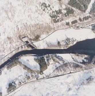 Oblique aerial view of the electricity generating power station, lodge, electricity transformer station and the remains of the possible barrow, taken from the SW.