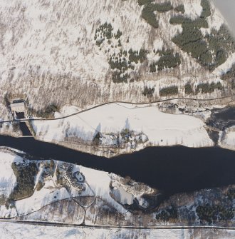 Oblique aerial view centred on the possible barrow with the electricity generating station and lodge adjacent, taken from the SSW.