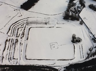 Oblique aerial view centred on fort under cover of snow.