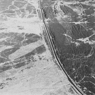 Oblique aerial view of Sheriff Muir centred on trackways, gun-emplacements, bunkers and trenches, taken from the SSW.